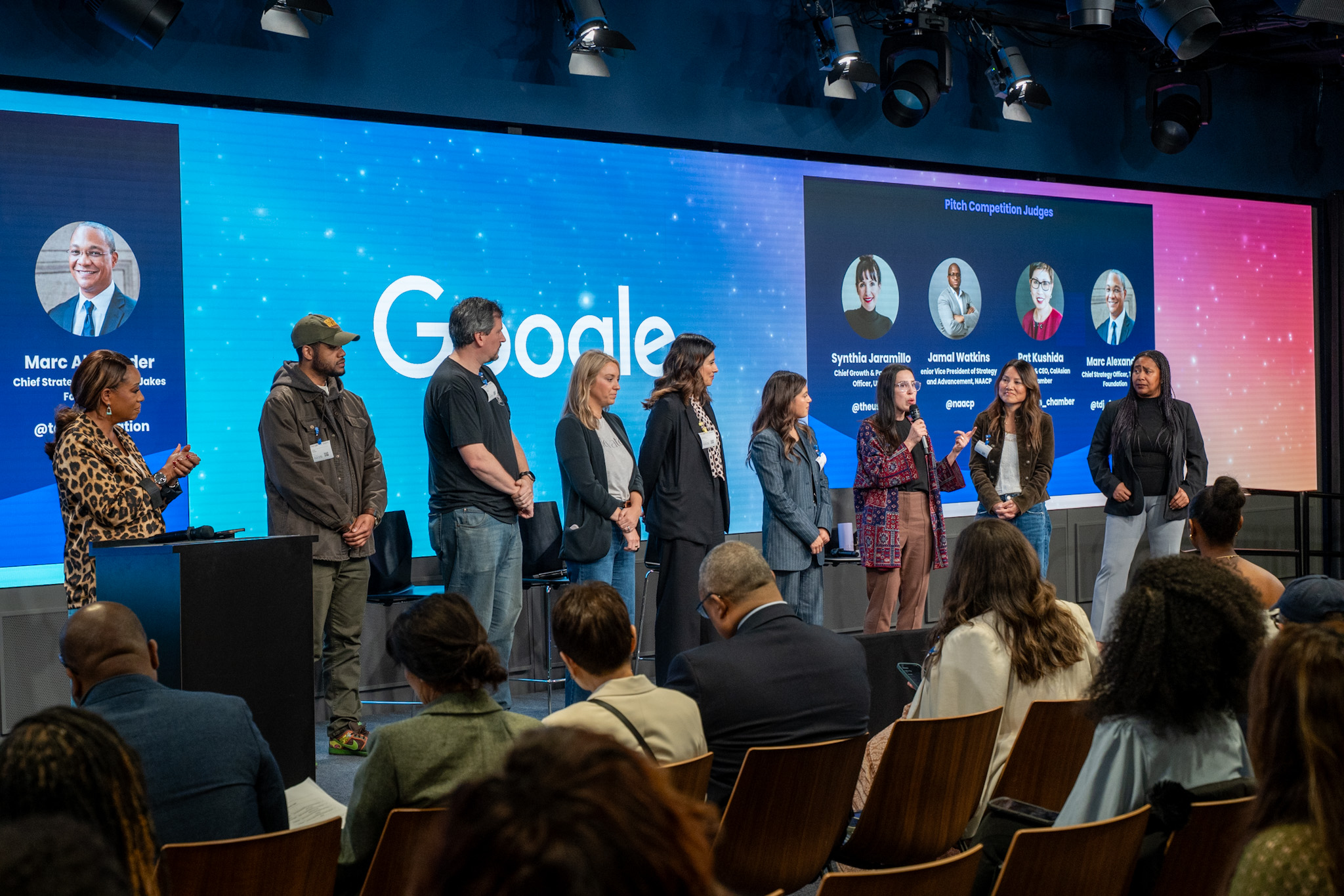 Pitch competition finalists on stage with judges at the LA Main Street Rising Tour stop